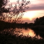 Sun_setting_over_Bedfont_Lakes__View_from_Bitten_Hide.jpg