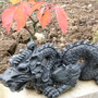 dragon ornament under the bonsai cherry tree