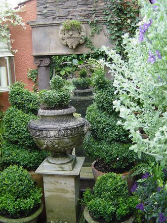 The classical urn standing in front of the temple ruin folly.